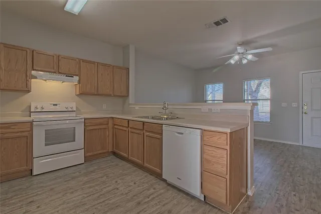 a kitchen with a sink and cabinets
