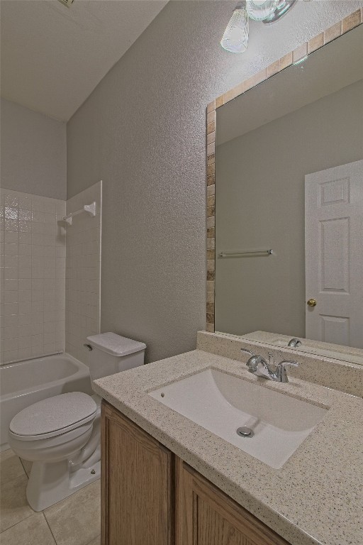 1102 East 3rd Street Georgetown, TX 78626 - Photo 24 of 36 Full bathroom with vanity, a textured wall, shower / tub combination, and light tile patterned floors
