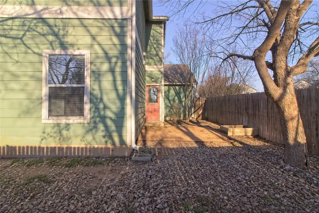 a view of a backyard of the house