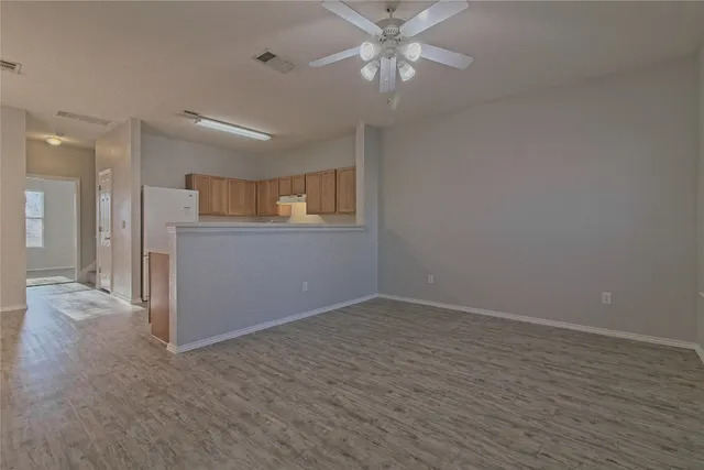 a kitchen with a stove oven and white cabinets