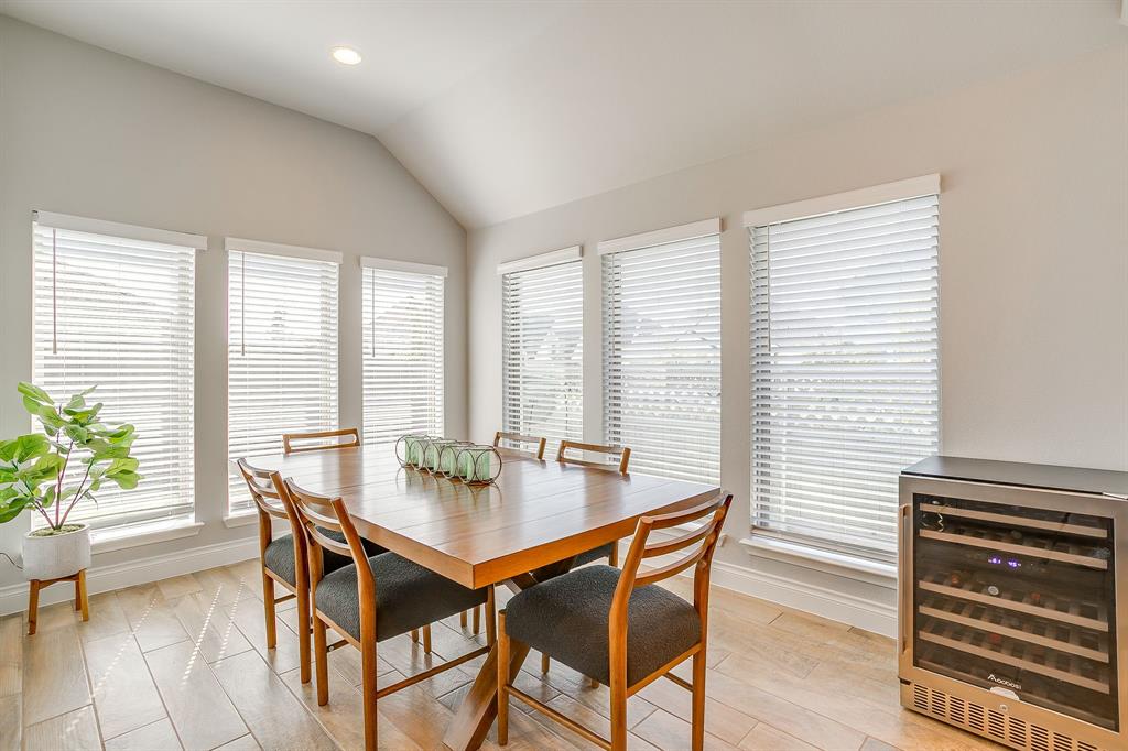 2453 Lazy Dog Lane Northlake, TX 76247 - Photo 14 of 40 Dining room featuring beverage cooler, plenty of natural light, light wood-style floors, vaulted ceiling, and recessed lighting