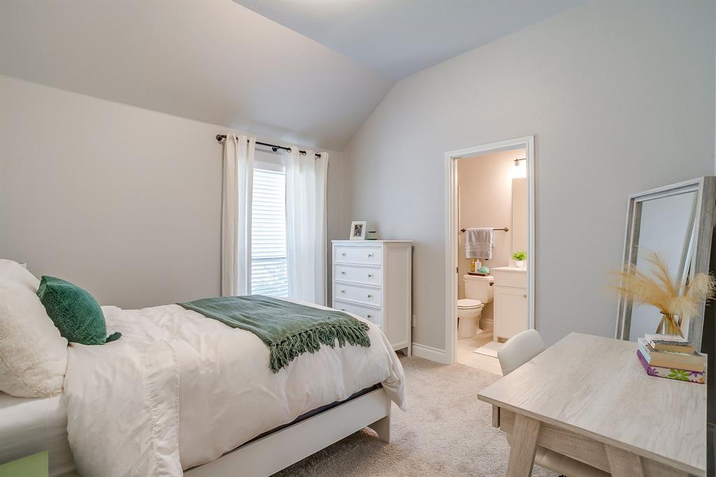 2453 Lazy Dog Lane Northlake, TX 76247 - Photo 18 of 40 Bedroom featuring light carpet, lofted ceiling, and connected bathroom