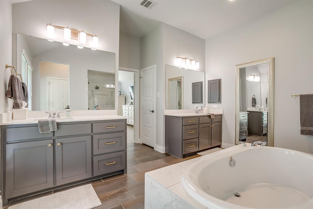 2453 Lazy Dog Lane Northlake, TX 76247 - Photo 24 of 40 Bathroom with a shower stall, two vanities, and a garden tub