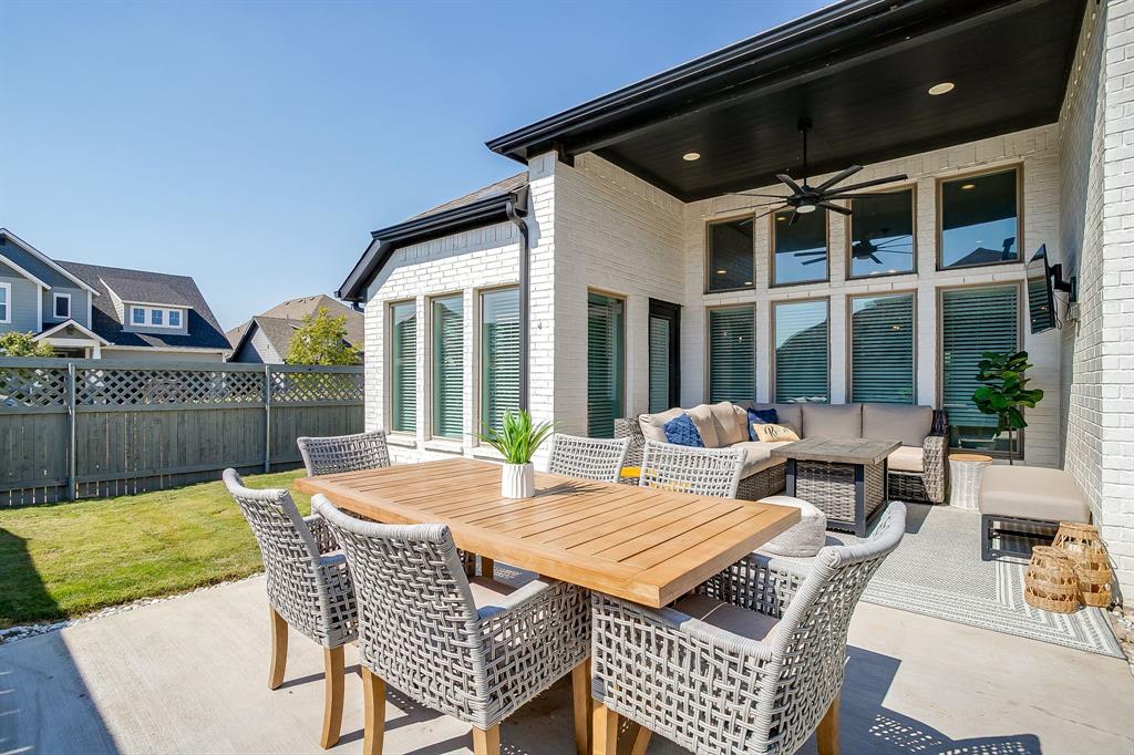 2453 Lazy Dog Lane Northlake, TX 76247 - Photo 28 of 40 View of patio featuring ceiling fan, an outdoor hangout area, and outdoor dining area