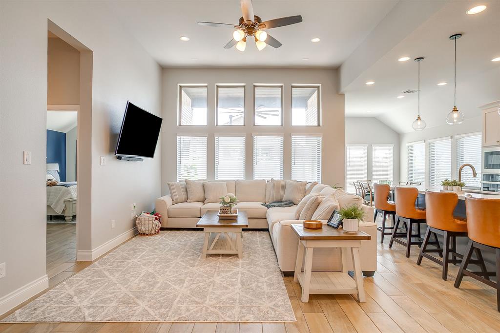 2453 Lazy Dog Lane Northlake, TX 76247 - Photo 7 of 40 Living area with light wood-style floors, recessed lighting, ceiling fan, and a towering ceiling