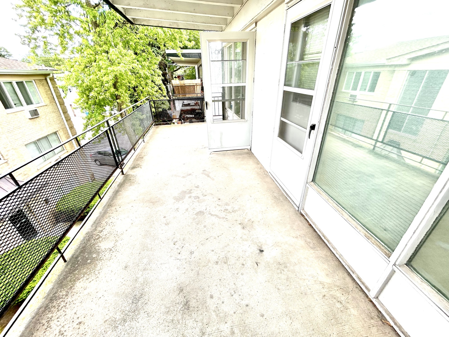 7446 Franklin Street, Unit 1NE Forest Park, IL 60130 - Photo 7 of 7 a view of balcony with wooden floor and seating space