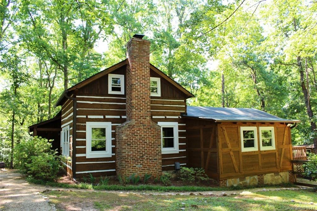6915 Old Ridge Road Waxhaw, NC 28173 - Photo 3 of 21 a front view of a house with garden