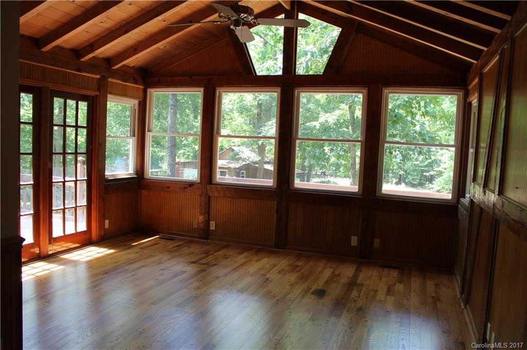 6915 Old Ridge Road Waxhaw, NC 28173 - Photo 7 of 21 a view of an empty room with a window and wooden floor