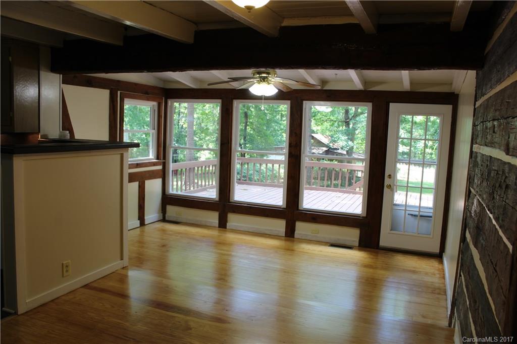 6915 Old Ridge Road Waxhaw, NC 28173 - Photo 8 of 21 a view of an empty room with wooden floor and a window