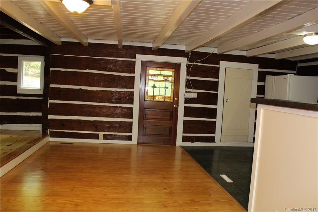6915 Old Ridge Road Waxhaw, NC 28173 - Photo 9 of 21 a view of an empty room with wooden floor and a window