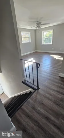 a view of staircase with wooden floor