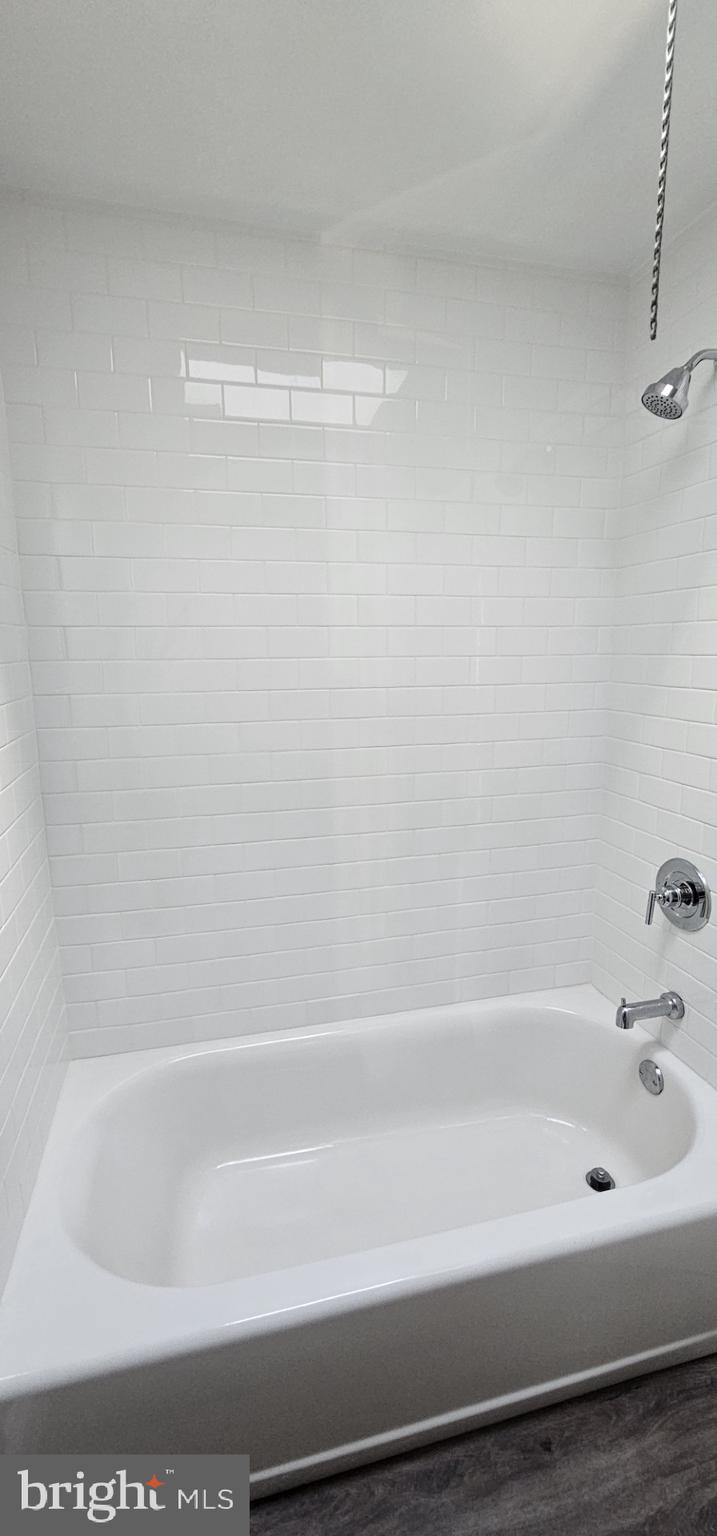2625 Parkside Terrace Brookhaven, PA 19015 - Photo 10 of 14 a bathroom with a bathtub