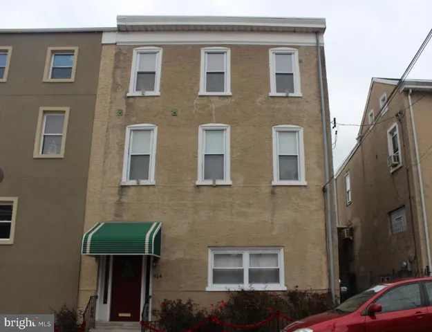 a front view of a house with yard