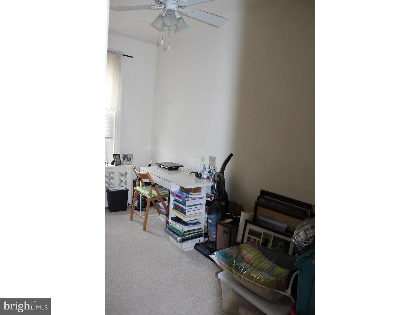 414 Leverington Avenue, Unit 2 Philadelphia, PA 19128 - Photo 12 of 17 a living room with furniture and a potted plant