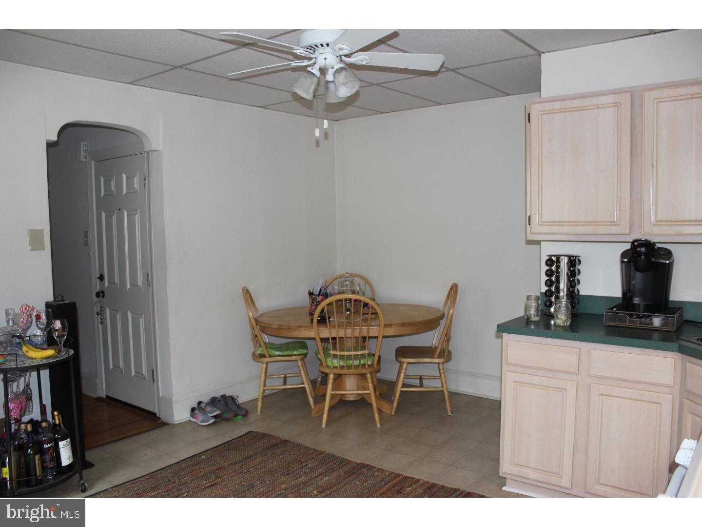 414 Leverington Avenue, Unit 2 Philadelphia, PA 19128 - Photo 7 of 17 a dining room with furniture and wooden floor