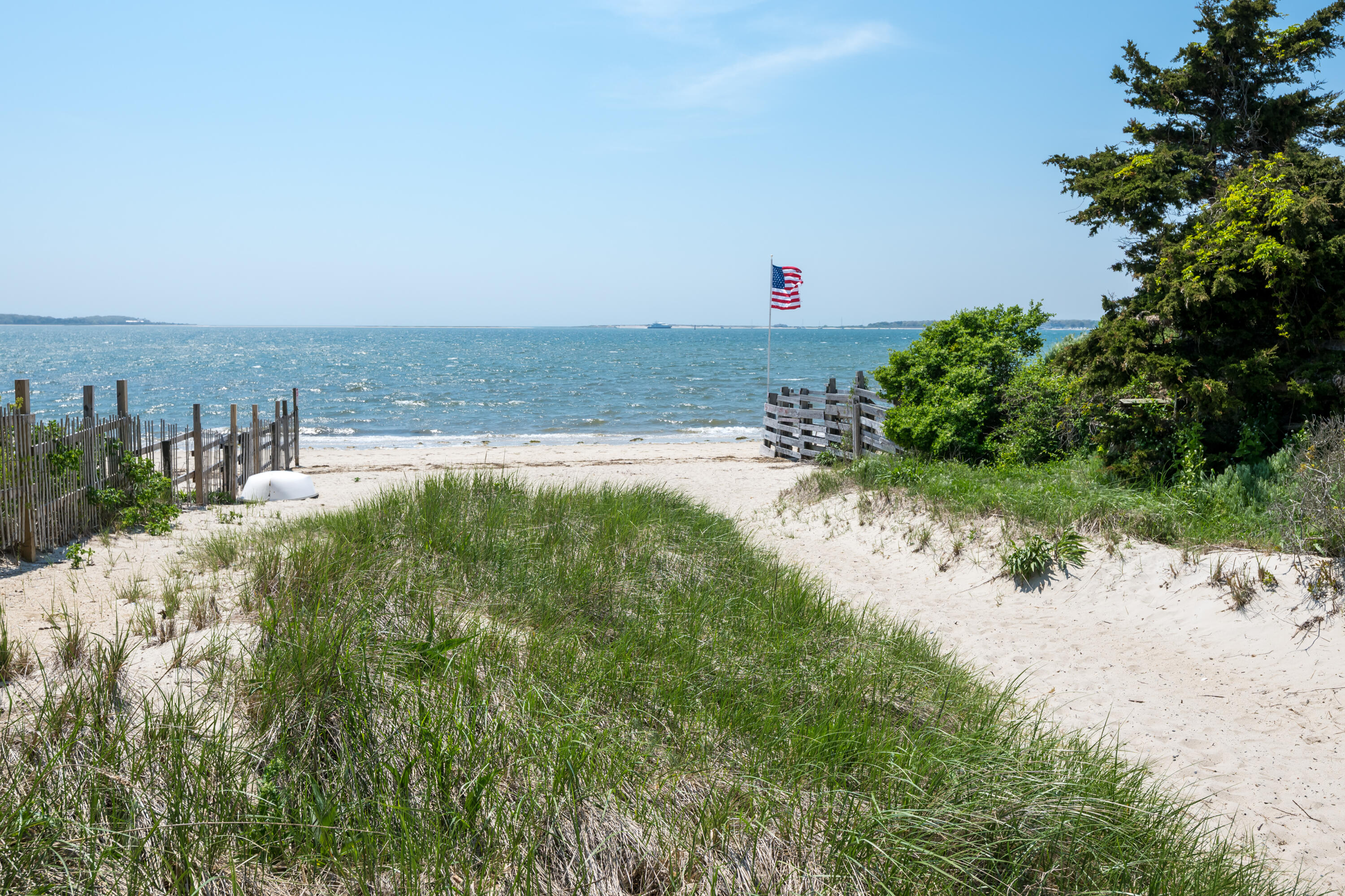 111 Lewis Road West Yarmouth, MA 02673 - Photo 30 of 43 a view of a lake with a building in the background
