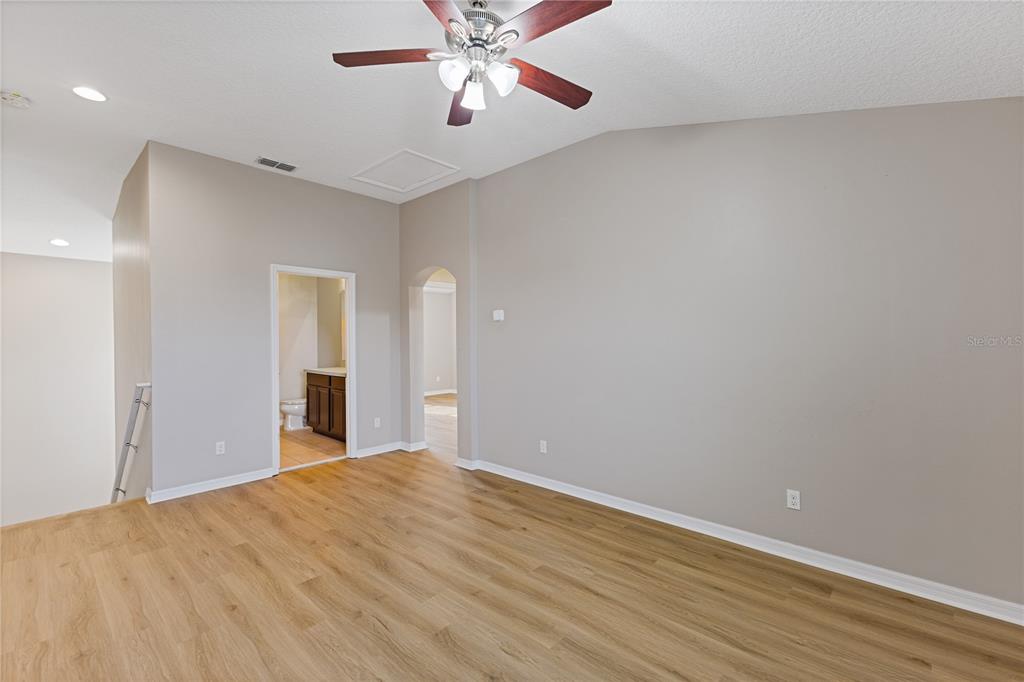 506 Rainbow Springs Loop Groveland, FL 34736 - Photo 14 of 30 a view of empty room with wooden floor