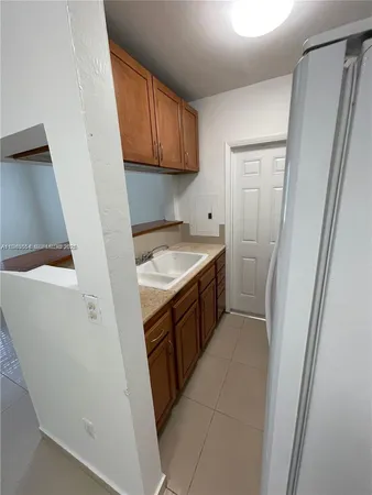 a utility room with a sink a washer and dryer