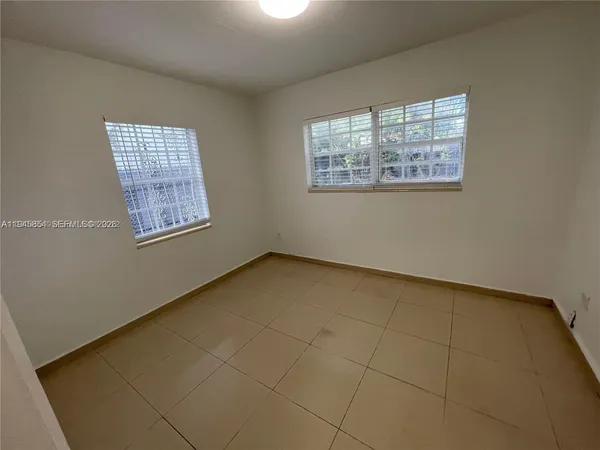 an empty room with windows