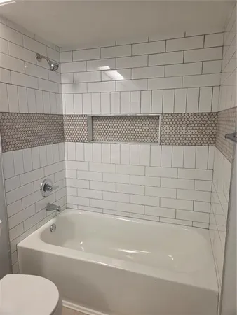 a bathroom with a white bathtub