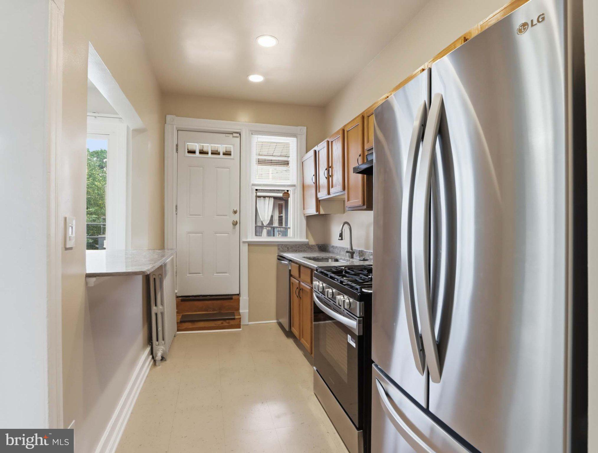 140 U Street Northeast Washington, DC 20002 - Photo 11 of 34 Modern kitchen with access to outdoor living.