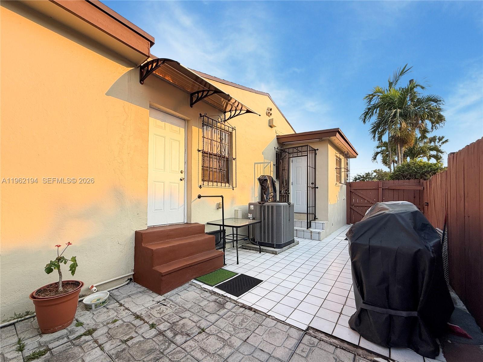 8891 Southwest 28th Street Miami, FL 33165 - Photo 14 of 21 PRIVATE ENTRANCE TO BEDROOM