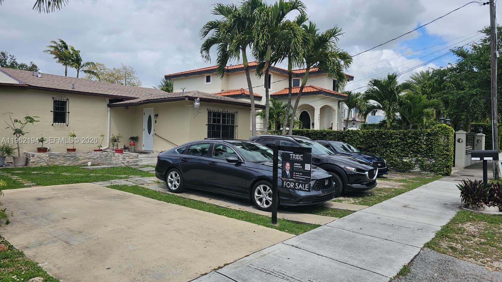 8891 Southwest 28th Street Miami, FL 33165 - Photo 20 of 25 a car parked in front of a house