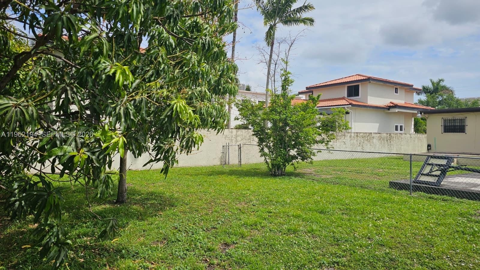 8891 Southwest 28th Street Miami, FL 33165 - Photo 21 of 25 a house view with a garden space