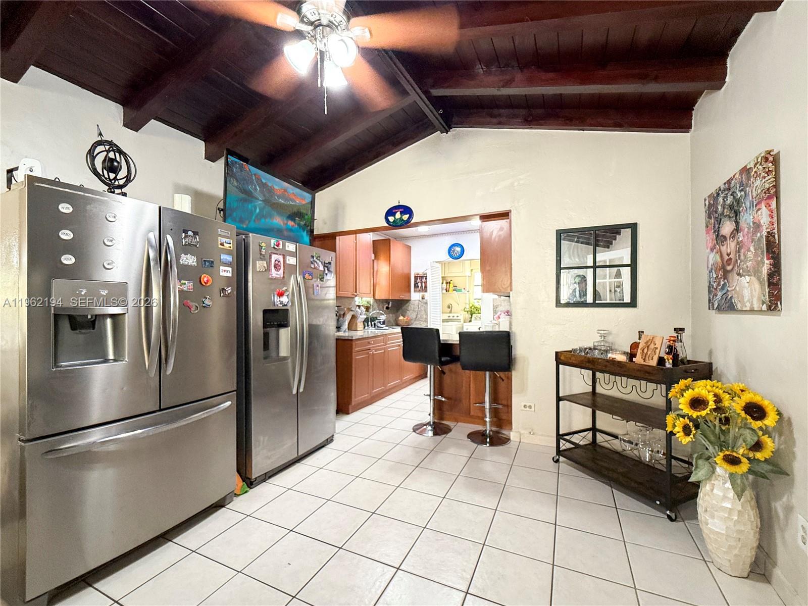 8891 Southwest 28th Street Miami, FL 33165 - Photo 6 of 25 a kitchen with stainless steel appliances kitchen island granite countertop a refrigerator and a sink