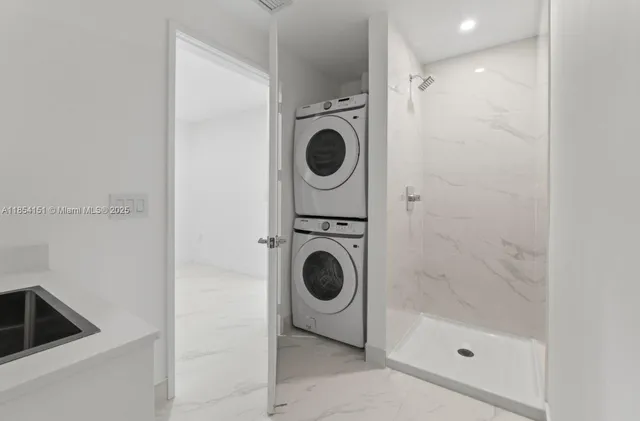 a bathroom with a sink and a washing machine