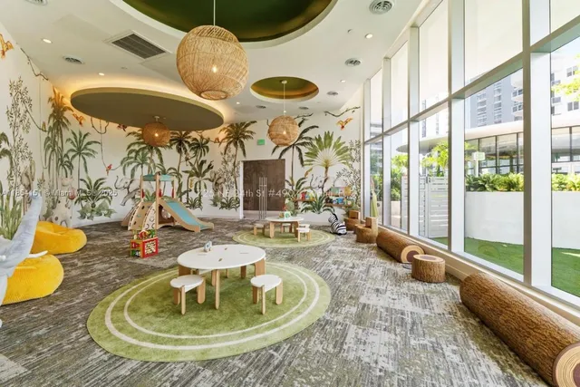 a room with lots of table and chairs