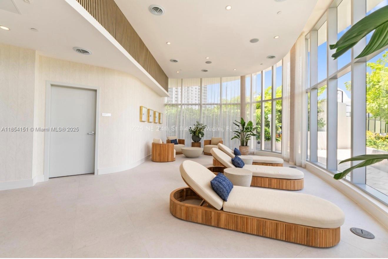 700 Northeast 24th Street, Unit 4907 Miami, FL 33137 - Photo 43 of 47 a living room with furniture and a large window