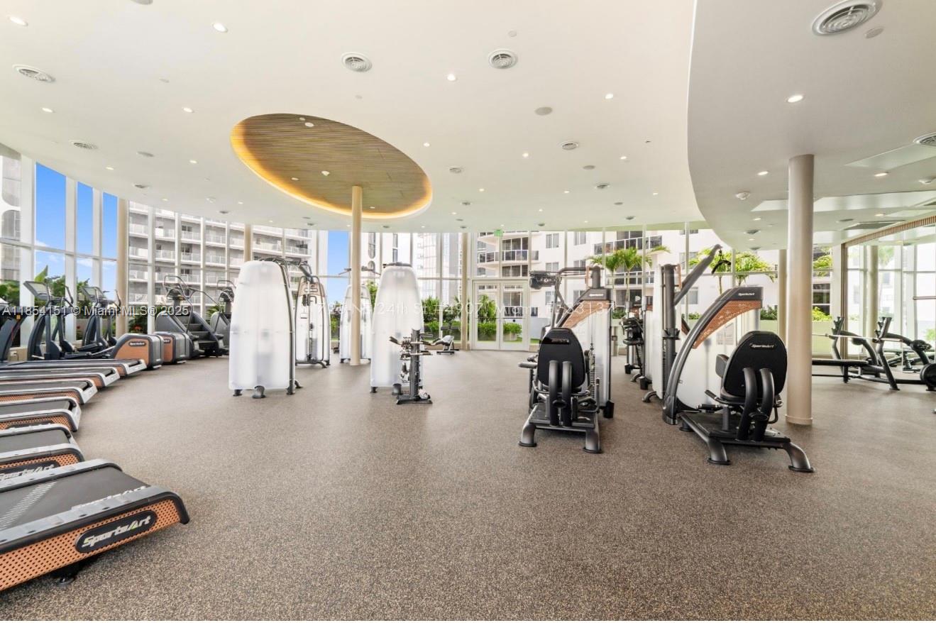 700 Northeast 24th Street, Unit 4907 Miami, FL 33137 - Photo 44 of 47 a view of a room with gym equipment