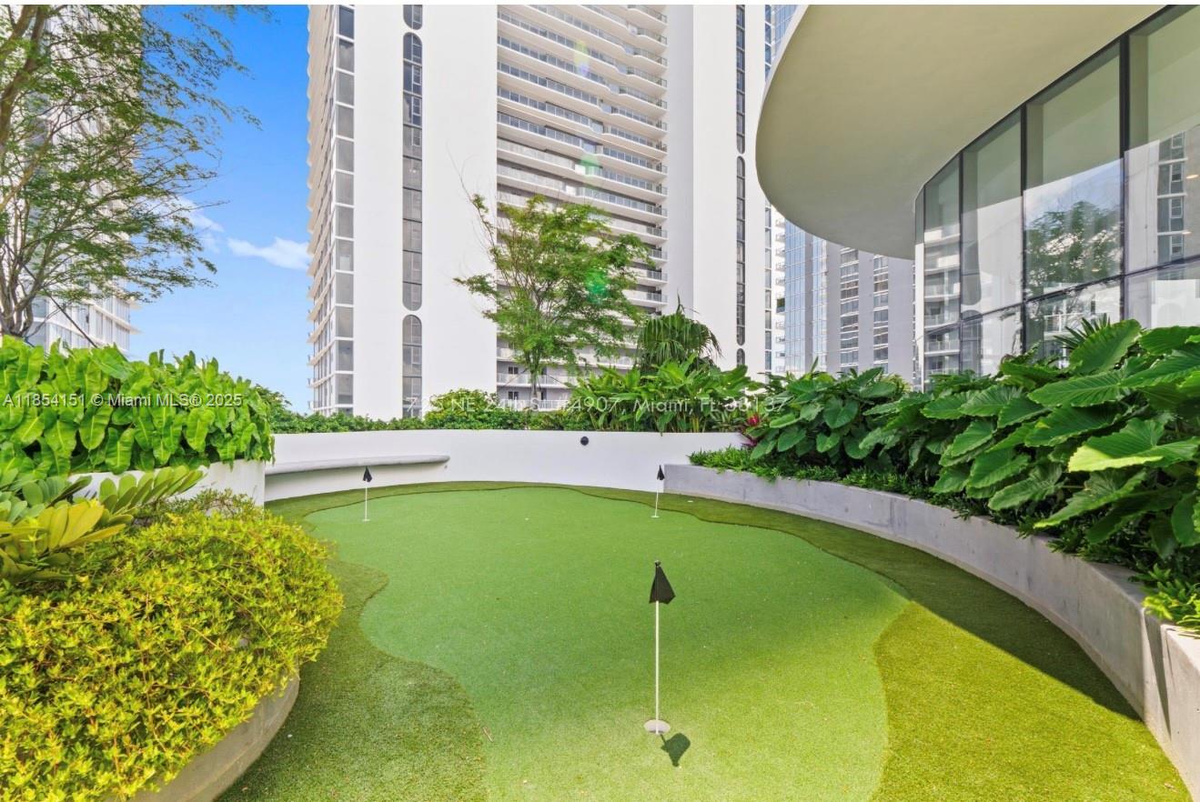 700 Northeast 24th Street, Unit 4907 Miami, FL 33137 - Photo 45 of 47 a view of swimming pool with a garden