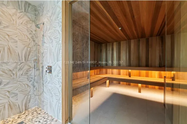 a view of a bathroom with a tub and a shower