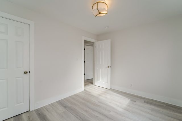 a view of a livingroom with wooden floor