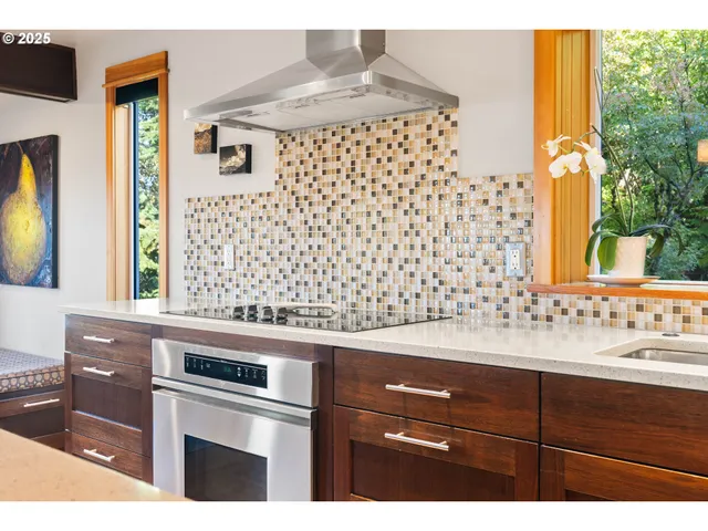 a kitchen with a sink a stove and a microwave