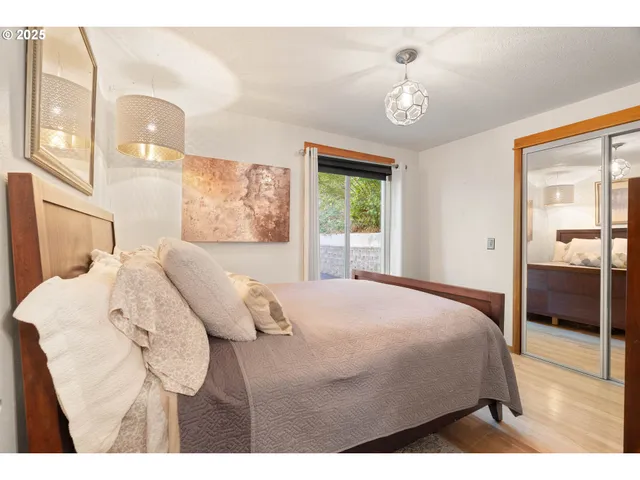 a bedroom with a bed and a view of bathroom