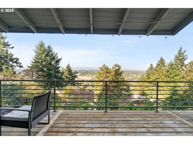 a view of a balcony with wooden floor