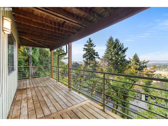 a view of balcony with wooden floor