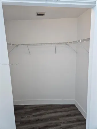 a view of an empty walk in closet