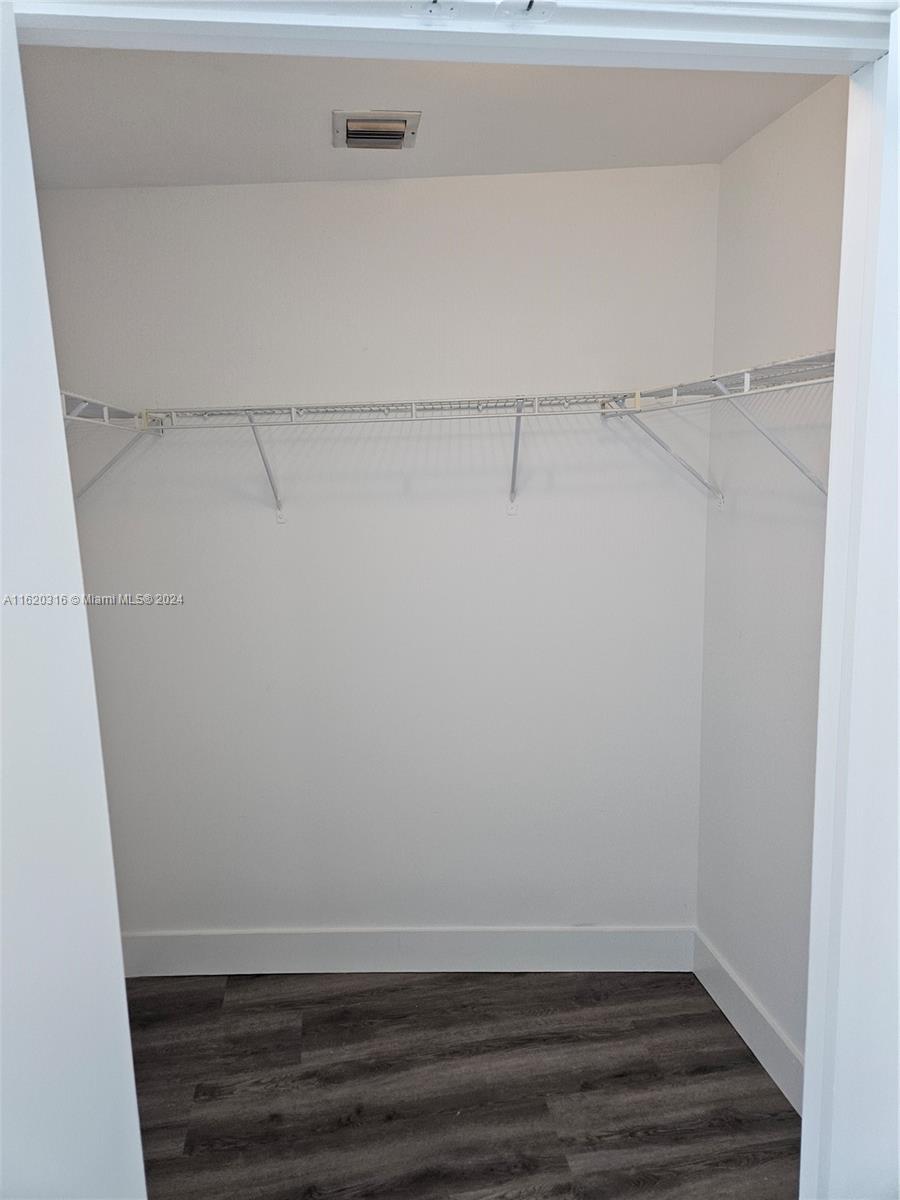 888 Biscayne Boulevard, Unit 2701 Miami, FL 33132 - Photo 19 of 37 a view of an empty walk in closet
