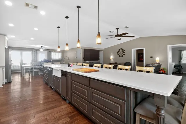 an aerial view of a house with a yard and lake view