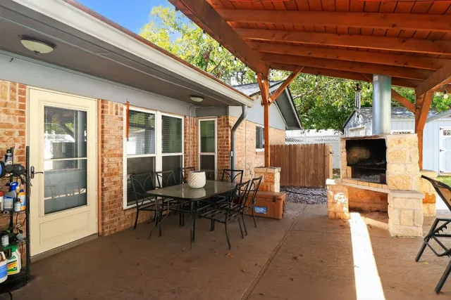 a spacious bathroom with a double vanity sink mirror and toilet