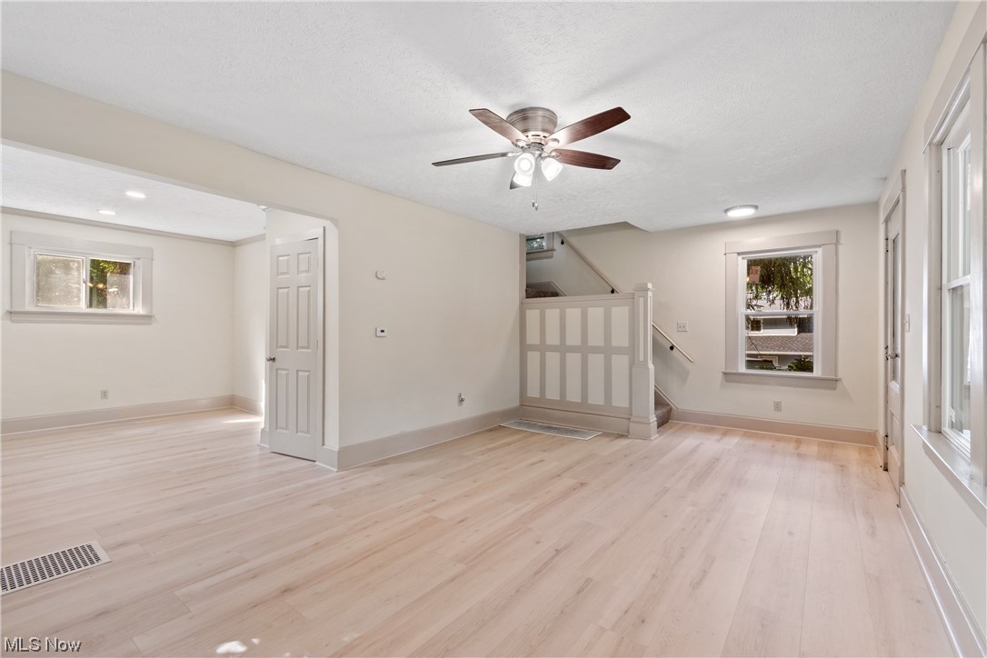 1474 Hampton Road Akron, OH 44305 - Photo 8 of 27 Hardwood floored spare room with a textured ceiling and ceiling fan