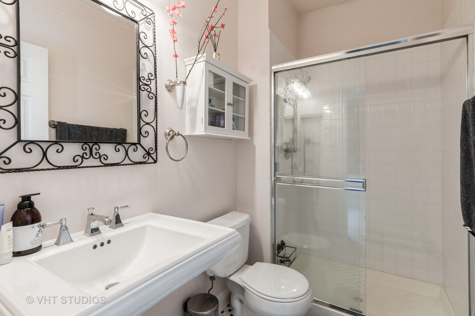 1867 Admiral Court Glenview, IL 60026 - Photo 17 of 28 a bathroom with a sink toilet and shower