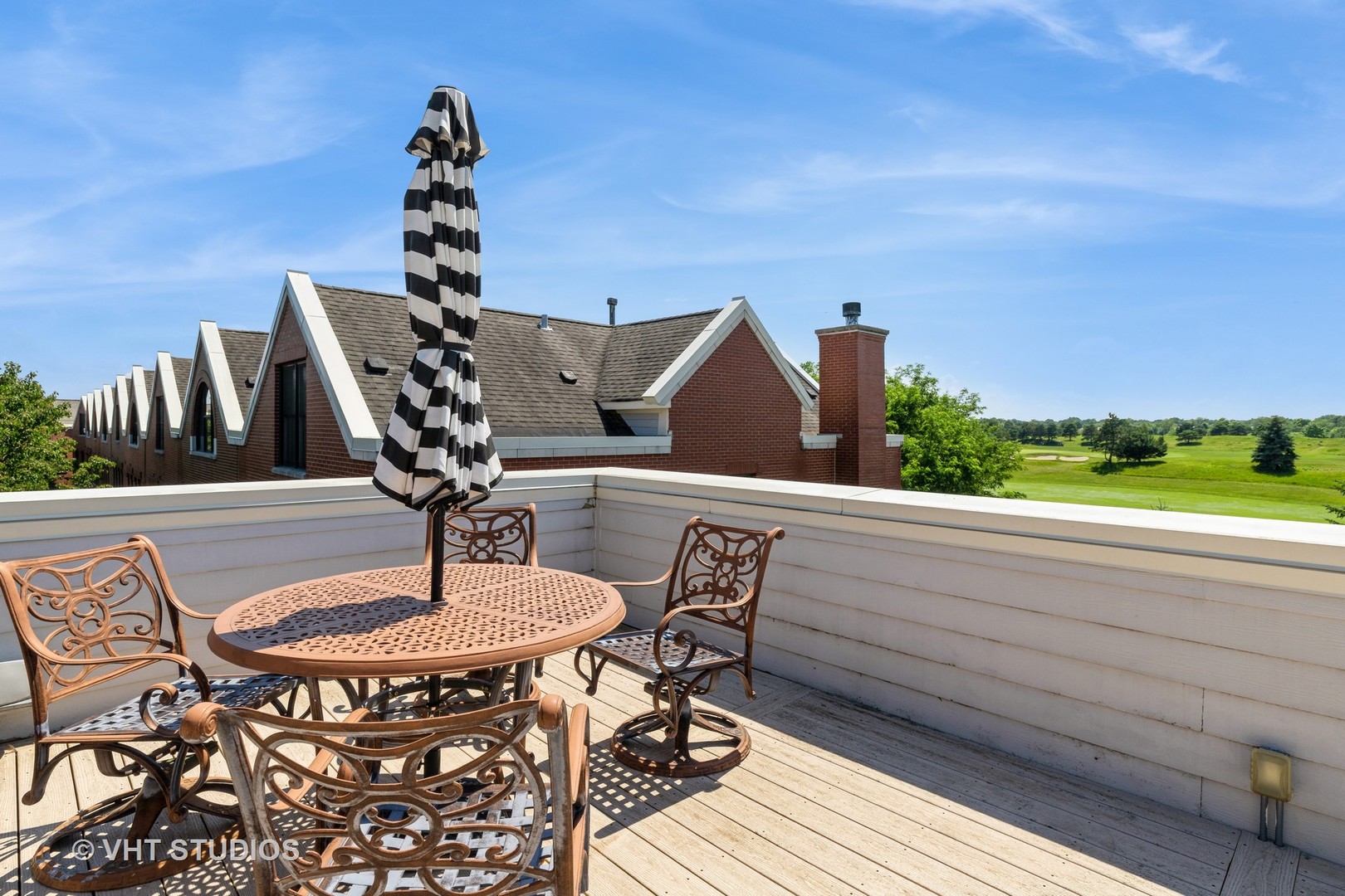 1867 Admiral Court Glenview, IL 60026 - Photo 23 of 28 a roof deck with dining table and chairs