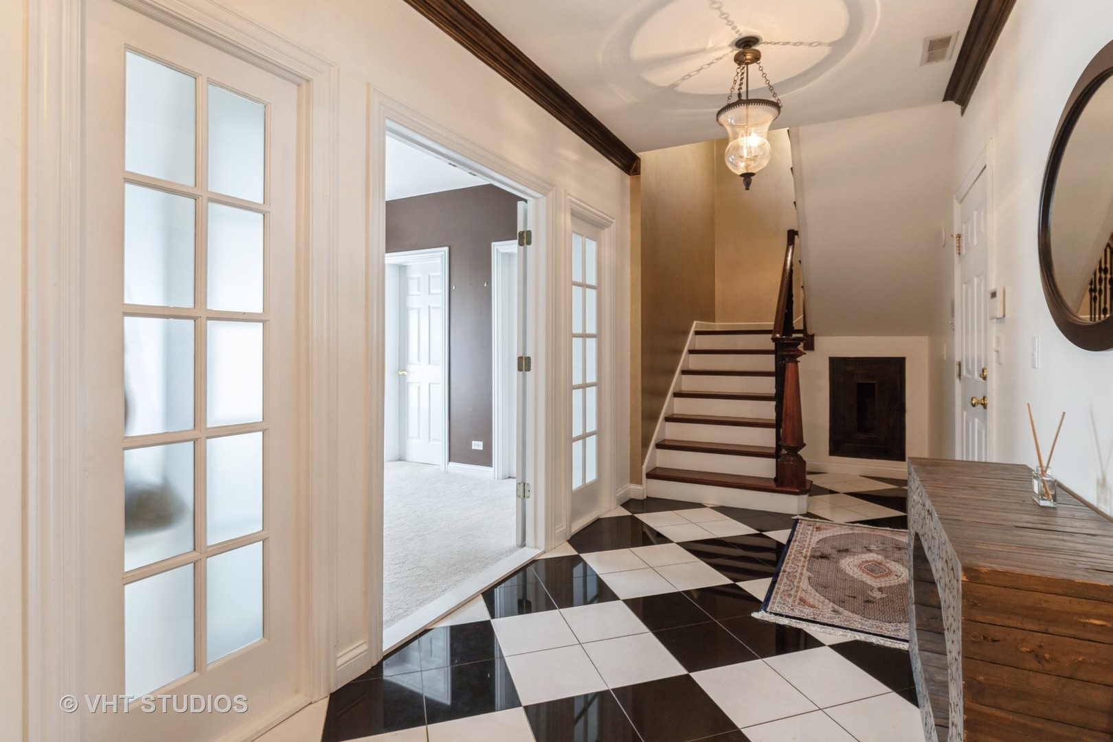 1867 Admiral Court Glenview, IL 60026 - Photo 3 of 28 a view of a hallway with front door and wooden floor