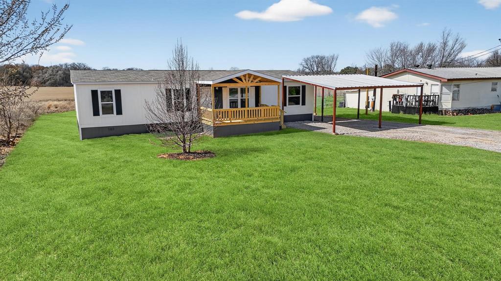 309 Rhett Court Aurora, TX 76078 - Photo 3 of 40 AI Generated Grass