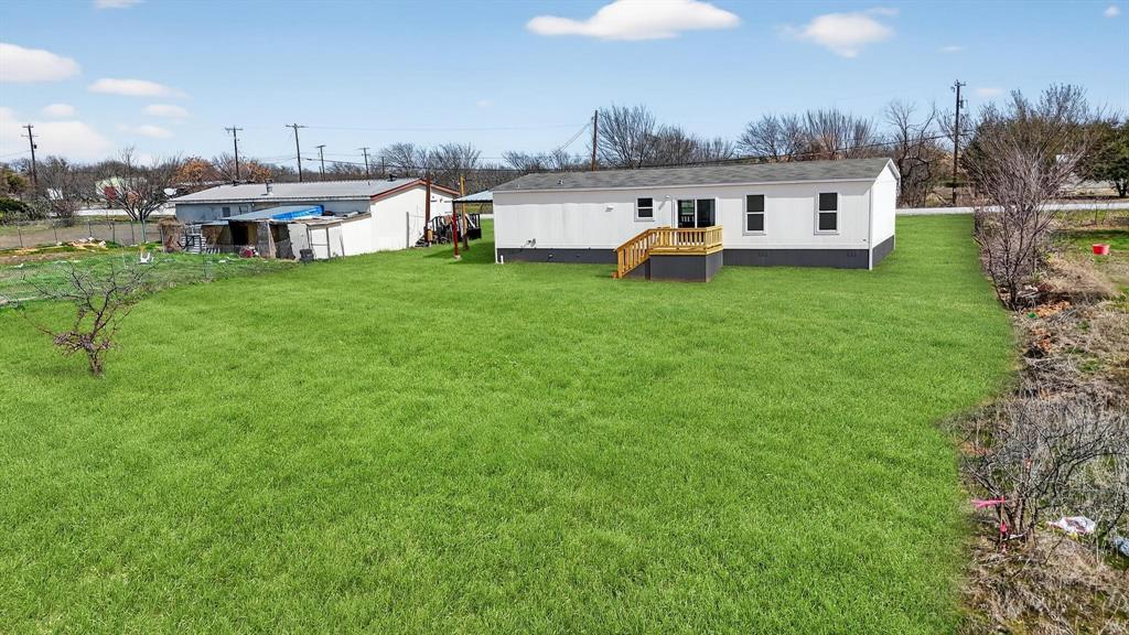 309 Rhett Court Aurora, TX 76078 - Photo 37 of 40 AI Generated Grass